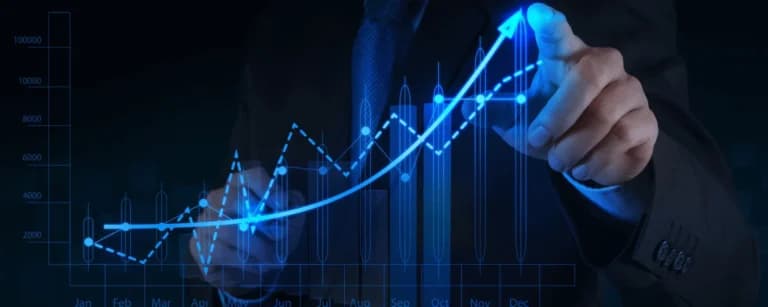 Investor analyzing an upward financial chart illustrating growth in property investment returns
