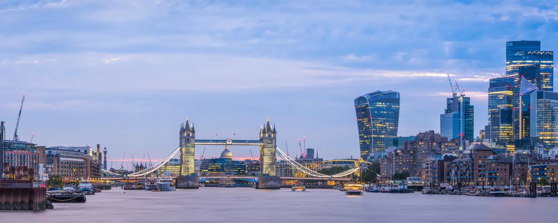 London skyline and Tower Bridge at dusk