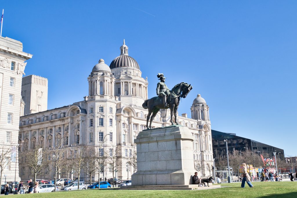Equestrian Statue in Front of Building and Green Space in Liverpool, UK.